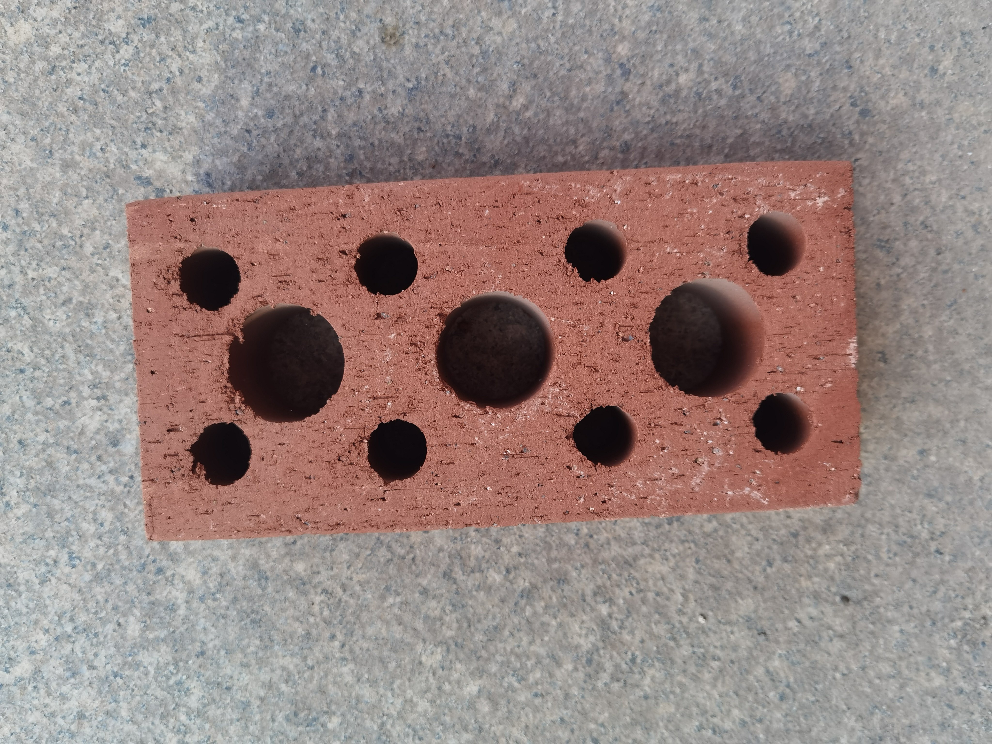 Rebar brick with holes