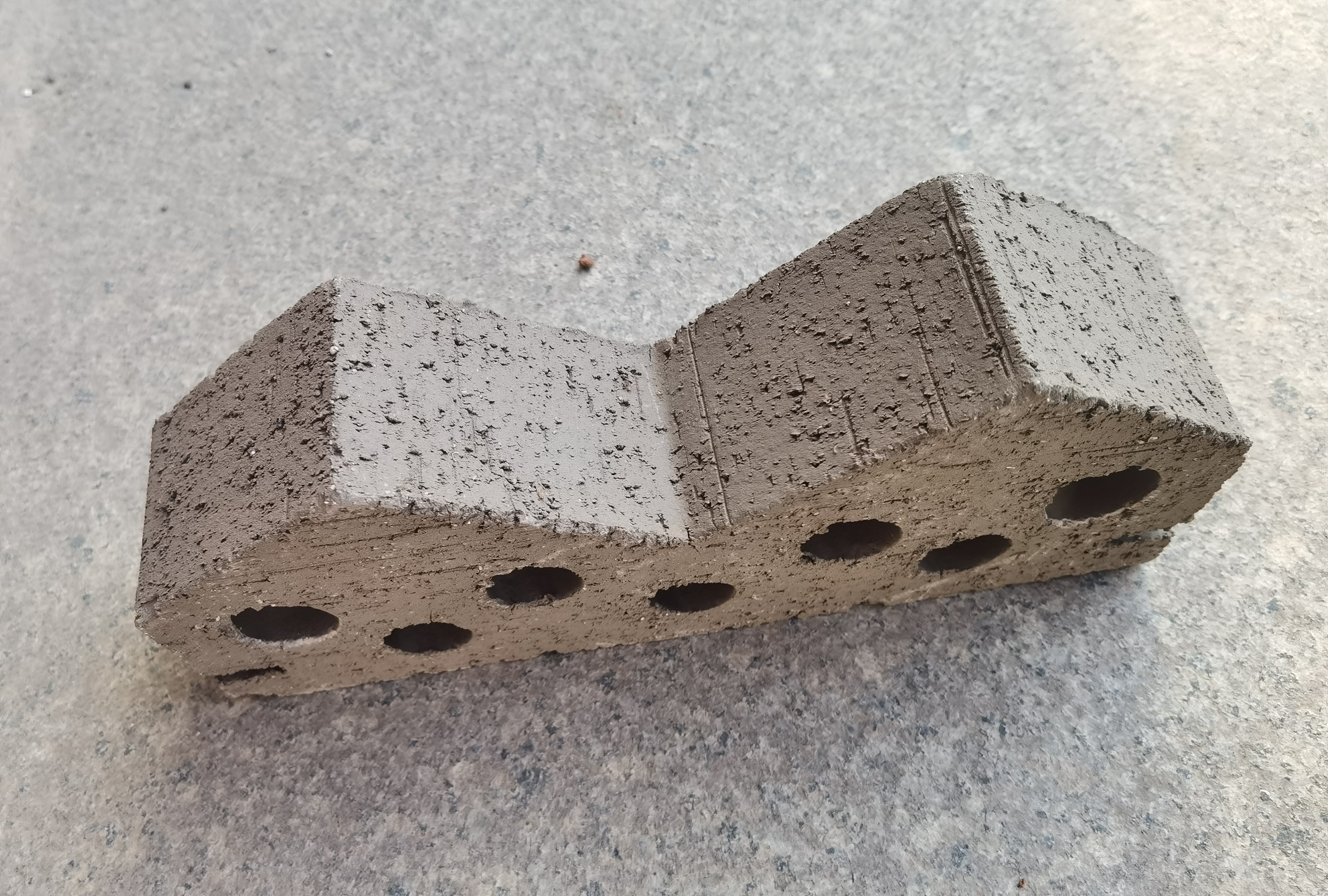 Corner brick with holes